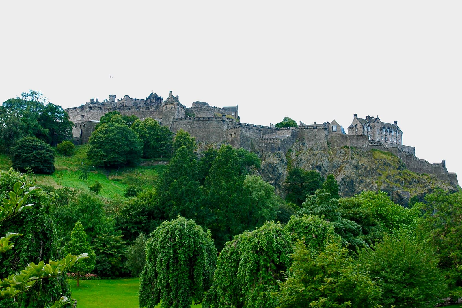 Edinburgh Castle on its dark volcanic rock, seen from Princes Street Gardens