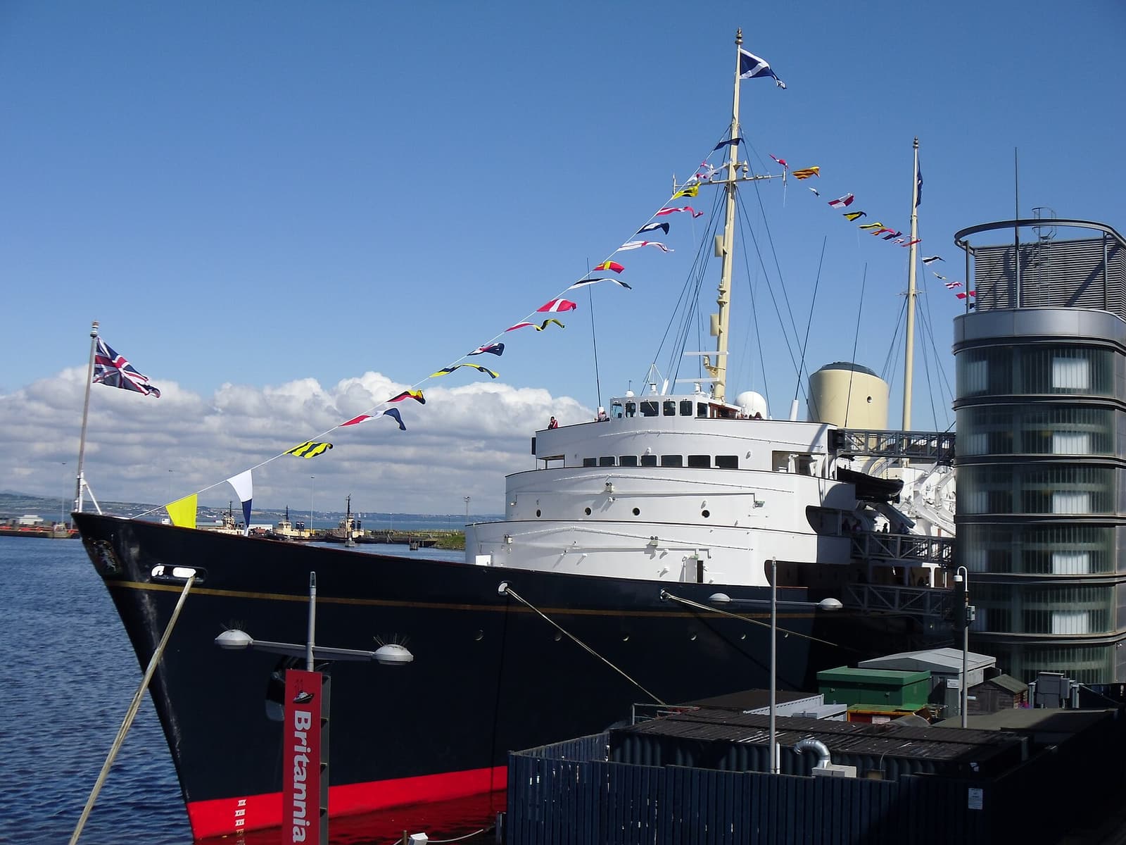 The Royal Yacht Britannia, dressed with signal flags, moored at Ocean Terminal in Leith
