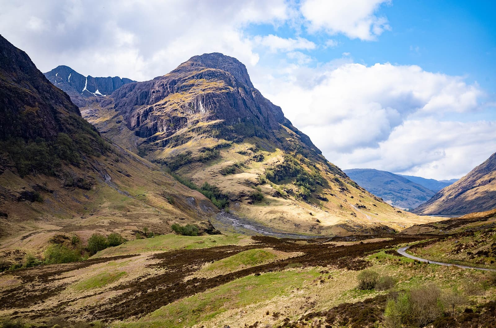 Sunlit mountains above the valley of Glencoe in the Scottish Highlands